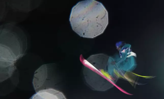 Switzerland's Mathilde Gremaud warms up before the women's freestyle skiing big air qualifications at the 2026 Winter Olympics, in Livigno, Italy, Saturday, Feb. 14, 2026. (AP Photo/Lindsey Wasson)