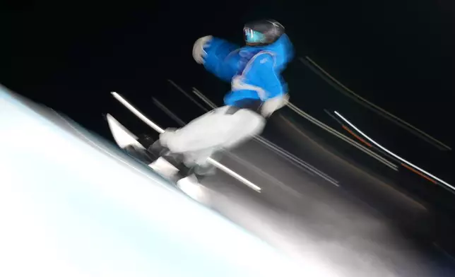 Italy's Marilu Poluzzi competes during the women's snowboard big air qualifications at the 2026 Winter Olympics, in Livigno, Italy, Sunday, Feb. 8, 2026. (AP Photo/Abbie Parr)