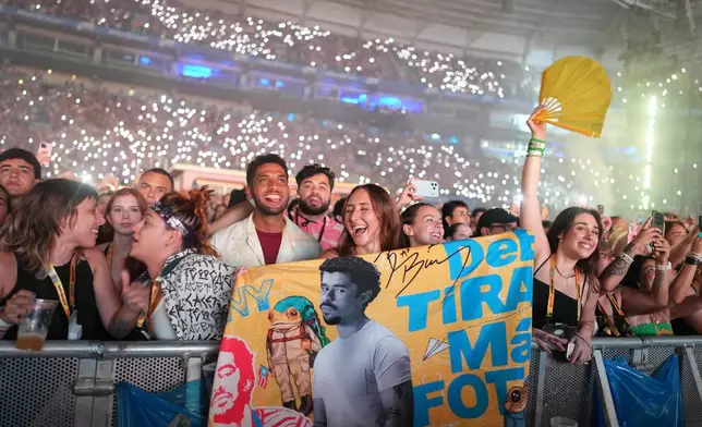 Fans cheer as Bad Bunny performs at Allianz Parque stadium in Sao Paulo, Friday, Feb. 20, 2026. (AP Photo/Andre Penner)