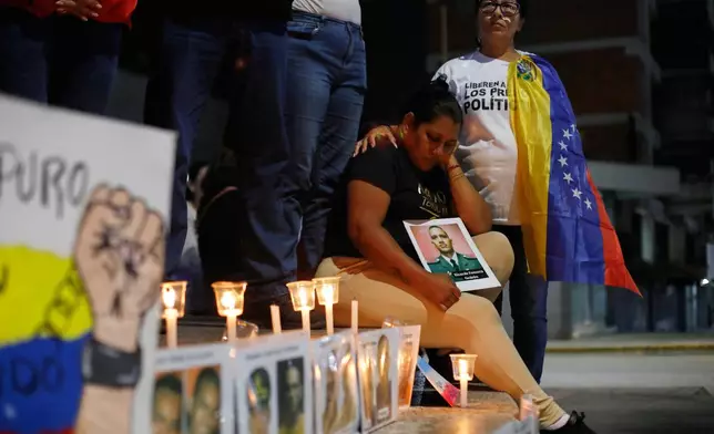 Relatives of detainees they say are held for political reasons wait outside El Helicoide, headquarters of Venezuela's intelligence service and a detention center, after the National Assembly approved an amnesty bill in Caracas, Venezuela, Thursday, Feb. 19, 2026. (AP Photo/Crisitian Hernandez)