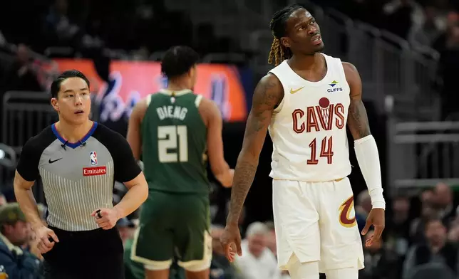 Cleveland Cavaliers' Keon Ellis (14) reacts during the second half of an NBA basketball game against the Milwaukee Bucks, Wednesday, Feb. 25, 2026, in Milwaukee. (AP Photo/Aaron Gash)