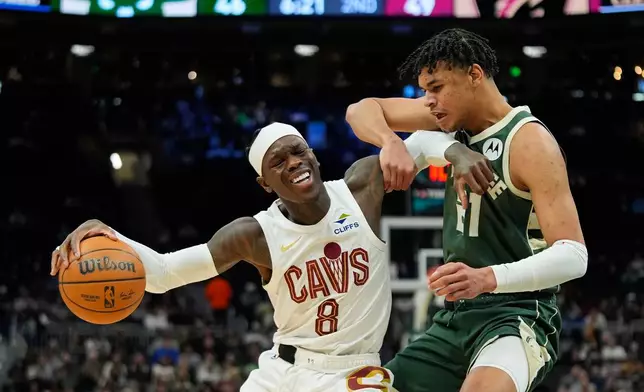 Cleveland Cavaliers' Dennis Schröder (8) drives to the basket against Milwaukee Bucks' Ousmane Dieng during the first half of an NBA basketball game, Wednesday, Feb. 25, 2026, in Milwaukee. (AP Photo/Aaron Gash)
