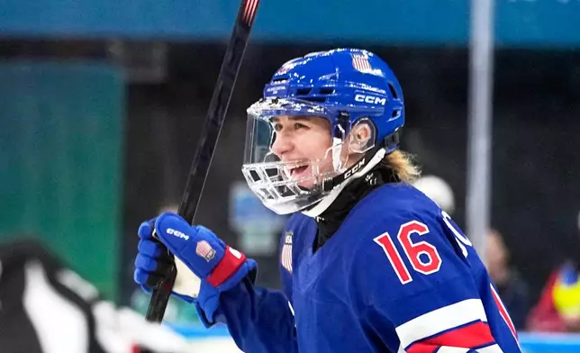 United States' Hayley Scamurra (16) celebrates after scoring her side's fifth goal during a women's ice hockey semifinal game between the United States and Sweden at the 2026 Winter Olympics, in Milan, Italy, Monday, Feb. 16, 2026. (AP Photo/Hassan Ammar)