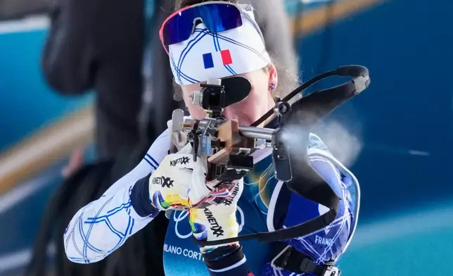 France's Julia Simon shoots during the 4x6-kilometer mixed relay biathlon race at the 2026 Winter Olympics, in Anterselva, Italy, Sunday, Feb. 8, 2026. (AP Photo/David J. Phillip)