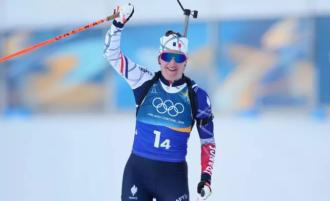 Julia Simon, of France, reacts as her team wins gold in the 4X6-kilometer mixed relay biathlon race at the 2026 Winter Olympics in Anterselva, Italy, Sunday, Feb. 8, 2026. (AP Photo/Andrew Medichini)