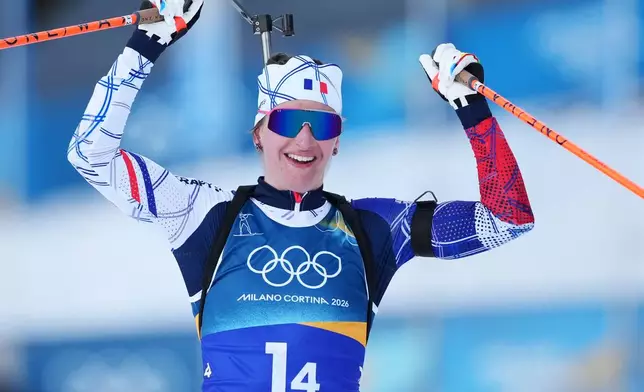 Julia Simon, of France, reacts as her team wins gold in the 4X6-kilometer mixed relay biathlon race at the 2026 Winter Olympics in Anterselva, Italy, Sunday, Feb. 8, 2026. (AP Photo/Andrew Medichini)