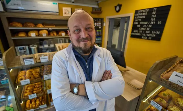 Denis Maksimov poses for a photo in the sales area of his bakery outside Moscow, Russia, on Wednesday, Feb. 18, 2026. (AP Photo/Alexander Zemlianichenko)