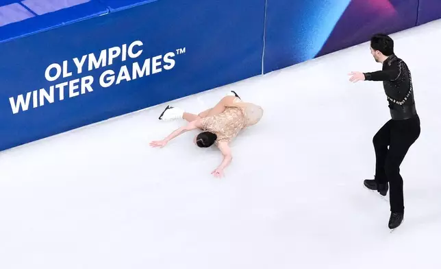 Deanna Stellato-Dudek and Maxime Deschamps of Canada compete during the pairs figure skating short program at the 2026 Winter Olympics, in Milan, Italy, Sunday, Feb. 15, 2026. (AP Photo/Bernat Armangue)