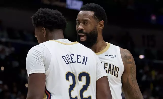 New Orleans Pelicans center DeAndre Jordan talks to center Derik Queen (22) after after Queen was pushed from behind by Philadelphia 76ers center Andre Drummond, not pictured, during the first half of an NBA basketball game in New Orleans, Saturday, Feb. 21, 2026. (AP Photo/Matthew Hinton)