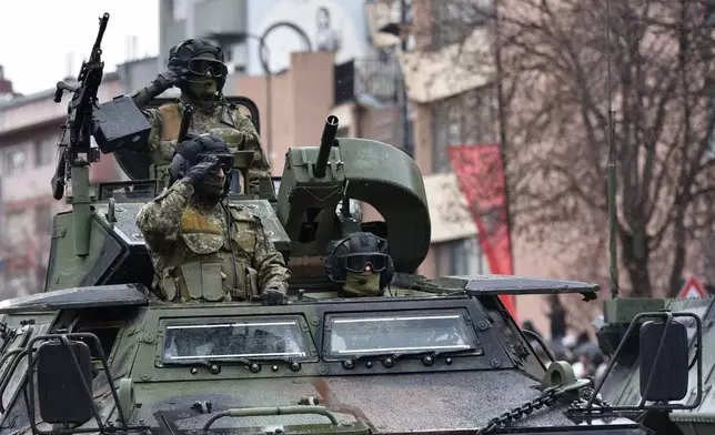 Kosovo Security Forces parade during celebrations to mark the 18th anniversary of independence, in Pristina, Kosovo, Tuesday, Feb. 17, 2026. (AP Photo/Laura Hasani)