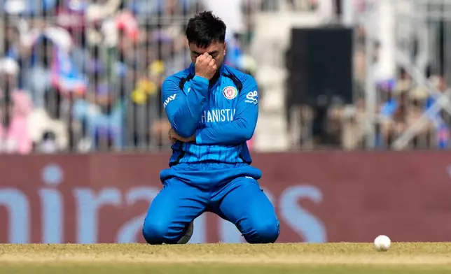 Afghanistan's captain Rashid Khan reacts after failing to catch a shot from New Zealand's Tim Seifert during the T20 World Cup cricket match between Afghanistan and New Zealand in Chennai, India, Sunday, Feb. 8, 2026. (AP Photo/Mahesh Kumar A.)