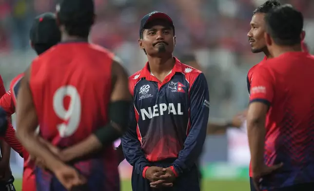 Nepal's captain Rohit Paudel ,center, reacts after losing the match against England during the T20 World Cup cricket in Mumbai, India, Sunday,Feb. 8, 2026.(AP Photo/Rafiq Maqbool)