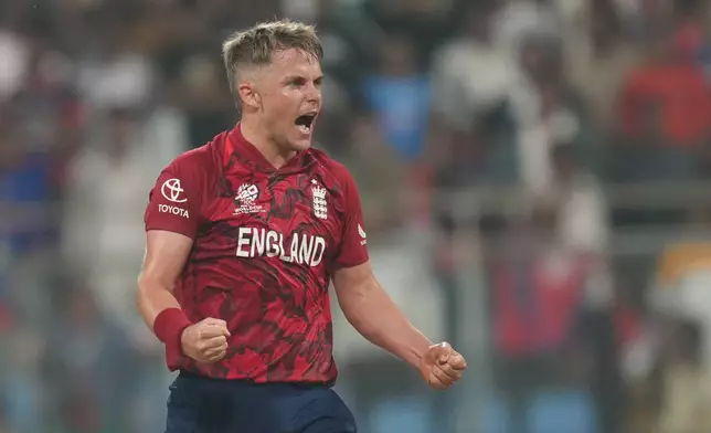 England's Sam Curran celebrates after wining against Nepal during the T20 World Cup cricket match in Mumbai, India, Sunday,Feb. 8, 2026.(AP Photo/Rafiq Maqbool)