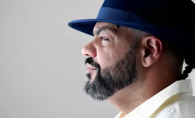 Derrick Johnson, whose mother's body was one of 189 left to decay in the Return to Nature Funeral Home in Penrose, Colo., poses for a portrait in Colorado Springs, Colo., on Thursday, Feb. 5, 2026. (AP Photo/Thomas Peipert)
