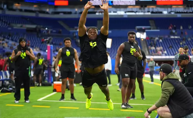 Texas A&amp;M defensive lineman Tyler Onyedim (23) runs a drill at the NFL football scouting combine in Indianapolis, Thursday, Feb. 26, 2026. (AP Photo/Julio Cortez)