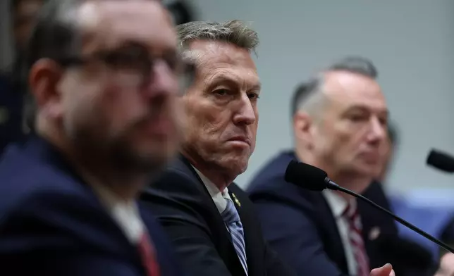 From left, Joseph Edlow, director of U.S. Citizenship and Immigration Services, Rodney Scott, commissioner of the U.S. Customs and Border Protection and Todd Lyons, senior official performing the duties of the director at U.S. Immigration and Customs Enforcement, listen during a Senate Homeland Committee hearing on Capitol Hill in Washington, Thursday, Feb. 12, 2026, in Washington. (AP Photo/Tom Brenner)