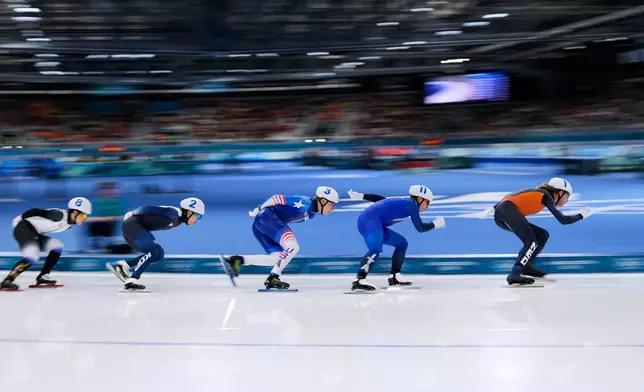 Jorrit Bergsma of the Netherlands is followed by Daniele di Stefano of Italy, Jordan Stolz of the U.S., Jae-won Chung of South Korea and Shomu Sasaki of Japan, as they compete in the men's mass start semifinal speedskating races at the 2026 Winter Olympics, in Milan, Italy, Saturday, Feb. 21, 2026. (AP Photo/Ben Curtis)