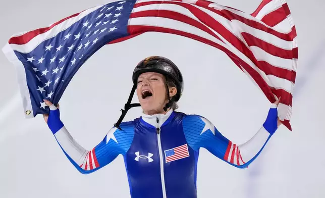 Mia Manganello of the U.S. celebrates winning the bronze medal in the women's mass start final speedskating race at the 2026 Winter Olympics, in Milan, Italy, Saturday, Feb. 21, 2026. (AP Photo/Luca Bruno)