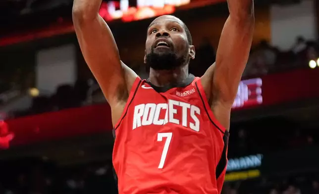 Houston Rockets forward Kevin Durant dunks against the Los Angeles Clippers during the first half of an NBA basketball game, Wednesday, Feb. 11, 2026, in Houston. (AP Photo/Eric Christian Smith)