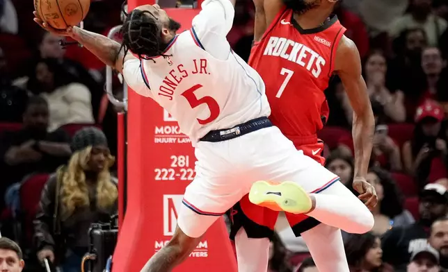 Los Angeles Clippers forward Derrick Jones Jr. (5) shoots as Houston Rockets forward Kevin Durant defends during the first half of an NBA basketball game, Wednesday, Feb. 11, 2026, in Houston. (AP Photo/Eric Christian Smith)