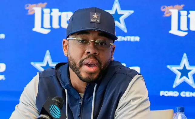 Christian Parker responds to questions during a news conference where he was introduced as the new defensive coordinator for the Dallas Cowboys NFL football team, Wednesday, Feb. 18, 2026, in Frisco, Texas. (AP Photo/Tony Gutierrez)