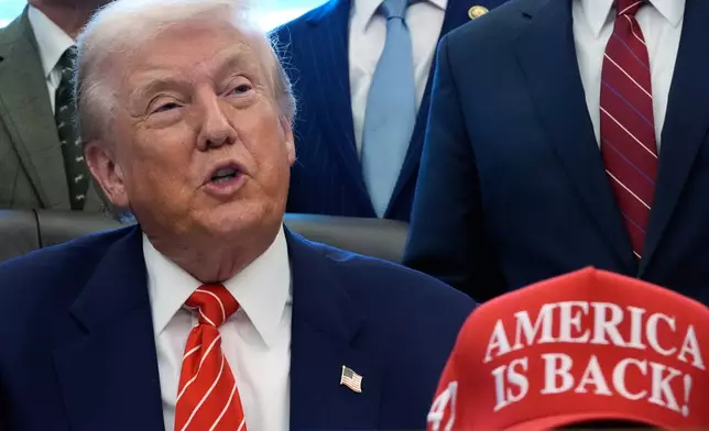 President Donald Trump speaks in the Oval Office of the White House, Tuesday, Feb. 3, 2026, in Washington, before signing a spending bill that will end a partial shutdown of the federal government. (AP Photo/Alex Brandon)