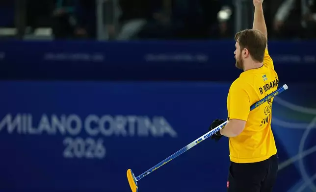 Sweden's Rasmus Wranaa reacts during the semi-finals round of the mixed doubles curling match against Britain, at the 2026 Winter Olympics, in Cortina d'Ampezzo, Italy, Monday, Feb. 9, 2026. (AP Photo/Fatima Shbair)