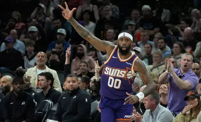 Phoenix Suns forward Royce O'Neale celebrates his 3-pointer against the Philadelphia 76ers during the first half of an NBA basketball game Saturday, Feb. 7, 2026, in Phoenix. (AP Photo/Ross D. Franklin)