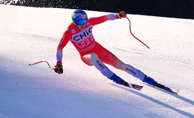 Switzerland's Marco Odermatt speeds down the course, during a men's World Cup downhill race, in Garmisch Partenkirchen, Germany, Saturday, Feb. 28, 2026. (AP Photo/Pier Marco Tacca)