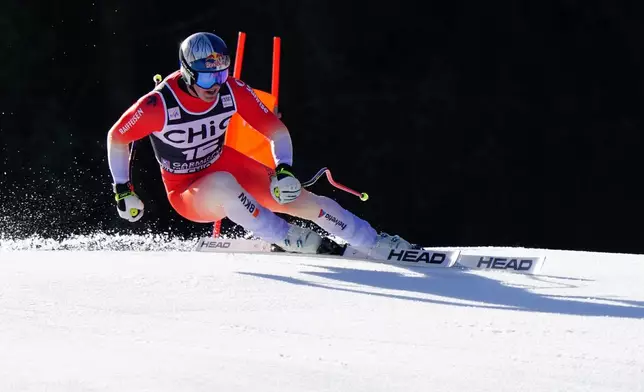 Switzerland's Franjo von Allmen speeds down the course, during a men's World Cup downhill race, in Garmisch Partenkirchen, Germany, Saturday, Feb. 28, 2026. (AP Photo/Pier Marco Tacca)
