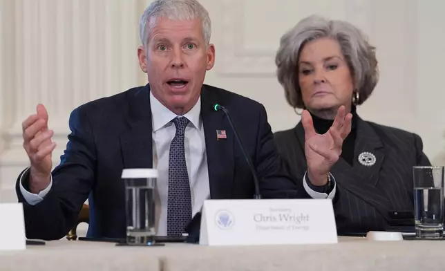 FILE - Energy Secretary Chris Wright speaks as White House chief of staff Susie Wiles listens during a meeting with President Donald Trump and oil executives in the East Room of the White House, Friday, Jan. 9, 2026, in Washington. (AP Photo/Evan Vucci, File)