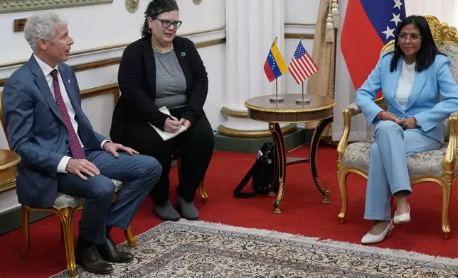 Venezuelan acting President Delcy Rodriguez, right, meets with U.S. Energy Secretary Chris Wright, left, at Miraflores presidential palace in Caracas, Venezuela, Wednesday, Feb. 11, 2026. (AP Photo/Ariana Cubillos)