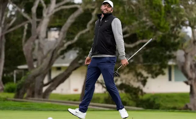 Scottie Scheffler reacts after missing a putt on the 16th hole at Pebble Beach Golf Links during the final round of the AT&amp;T Pebble Beach Pro-Am golf tournament in Pebble Beach, Calif., Sunday, Feb. 15, 2026. (AP Photo/Godofredo A. Vásquez)