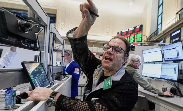Options trader Anthony Spina works on the floor of the New York Stock Exchange, Thursday, Feb. 19, 2026. (AP Photo/Richard Drew)