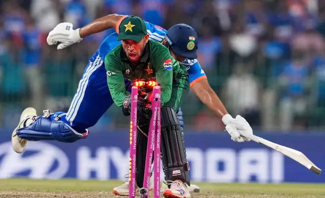 Pakistan's Usman Khan shatters the stumps to get India's Shivam Dube run out during the T20 World Cup cricket match between India and Pakistan in Colombo, Sri Lanka, Sunday, Feb. 15, 2026. (AP Photo/Eranga Jayawardena)
