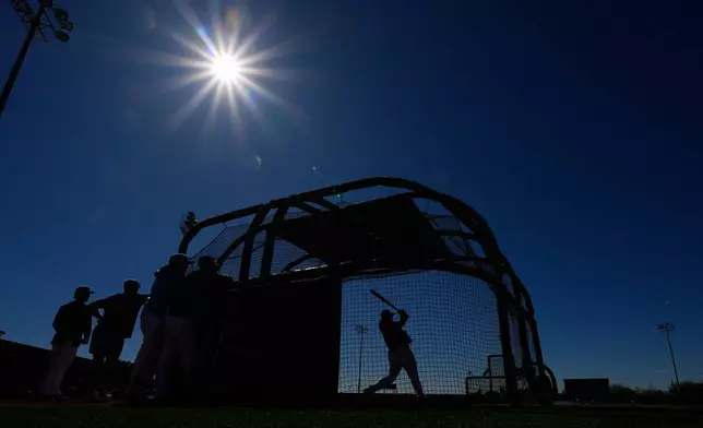 Kansas City Royals first baseman Vinnie Pasquantino bats during spring training baseball practice Saturday, Feb. 14, 2026, in Surprise, Ariz. (AP Photo/Charlie Riedel)