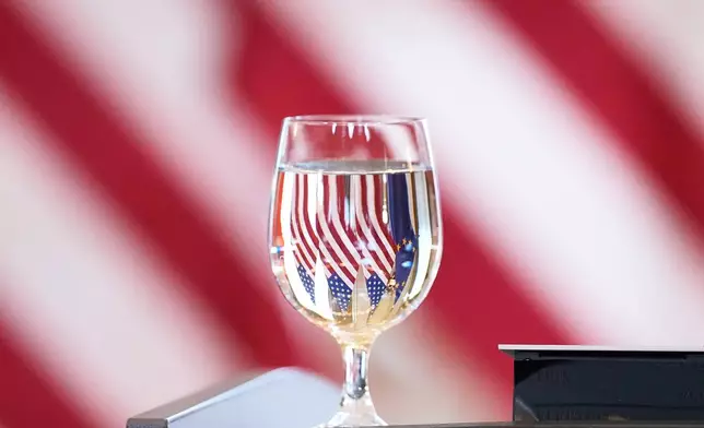 The United States and European Union flags are reflected in a glass before a joint news conference by U.S. Secretary of State Marco Rubio and Slovakia's Prime Minister Robert Fico in Bratislava, Slovakia, Sunday, Feb. 15, 2026. (AP Photo/Alex Brandon, Pool)