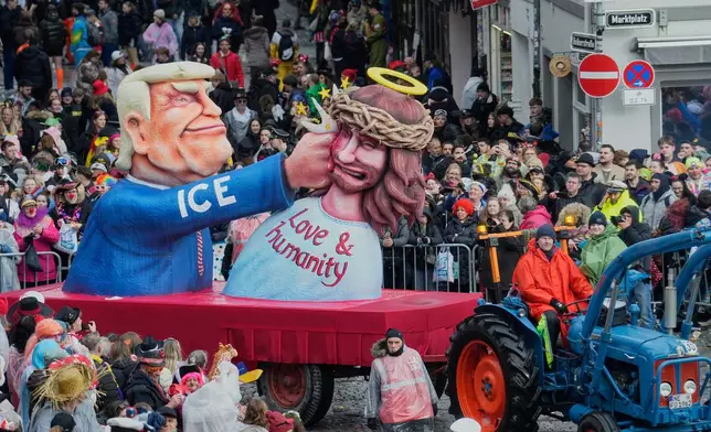A carnival float depicting US President Donald Trump is seen during the Rosemonday Carnival Parade in Duesseldorf, Germany, Monday, Feb. 16, 2026 (AP Photo/Martin Meissner)