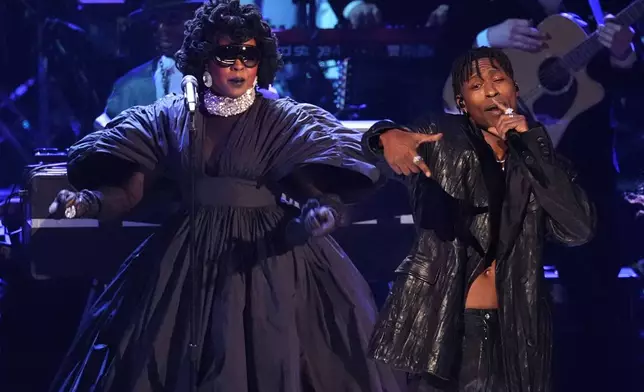 Lauryn Hill, left, and Lucky Daye perform an in memoriam tribute during the 68th annual Grammy Awards on Sunday, Feb. 1, 2026, in Los Angeles. (AP Photo/Chris Pizzello)