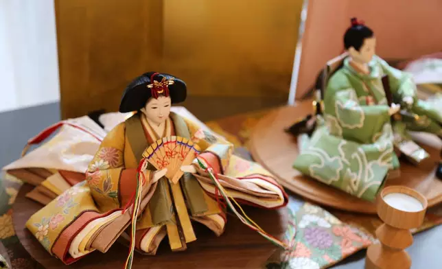 Dolls dressed in miniature kimonos made by designer Tomoko Ohkata from recycled kimonos are pictured in Tokyo, on Jan. 15, 2026. (AP Photo/Yuri Kageyama)