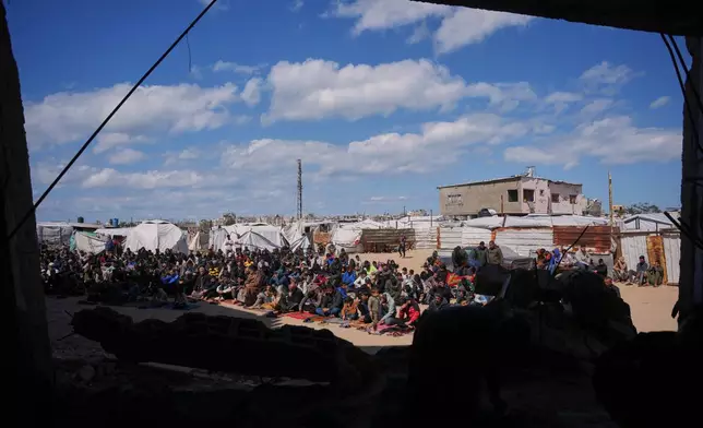 Muslim worshippers take part in the Friday prayers during the holy month of Ramadan outside the destroyed Al-Albani Mosque, in Khan Younis, southern Gaza Strip, Friday, Feb. 27, 2026. (AP Photo/Abdel Kareem Hana)