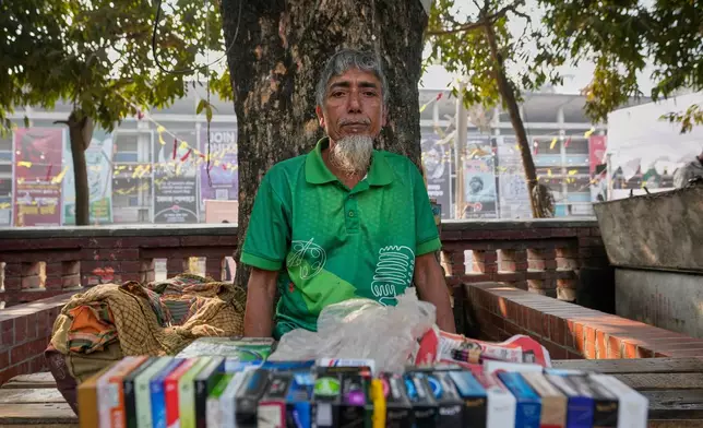 Mohammed Zainul Abedeen, 62, a tea seller vendor talks to Associated Press in Dhaka, Bangladesh, Sunday, Feb. 8, 2026. (AP Photo/Anupam Nath)