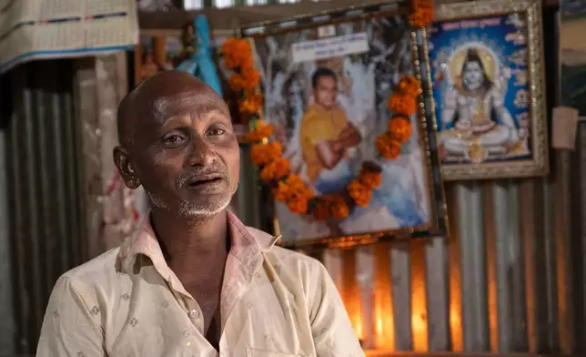 Robilal Chandra Das, father of Dipu Chandra Das, 27, speaks during an interview with The Associated Press inside his home in Tarakanda village, Mymensingh District, Bangladesh, Jan. 9, 2026. (AP Photo/Mahmud Hossain Opu)