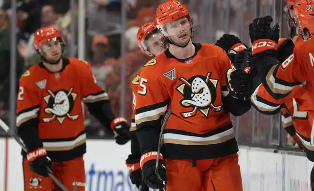 Anaheim Ducks defenseman Jacob Trouba celebrates his goal with the bench during the second period of an NHL hockey game against the Winnipeg Jets, Friday, Feb. 27, 2026, in Anaheim, Calif. (AP Photo/Kyusung Gong)