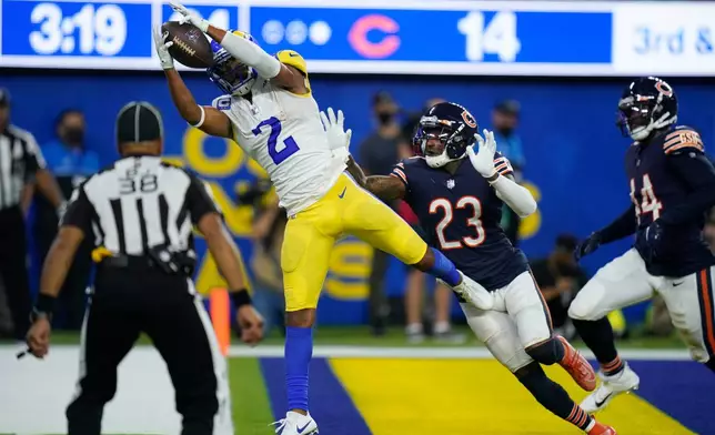 FILE - Los Angeles Rams wide receiver Robert Woods makes a catch in the end zone for a touchdown as Chicago Bears defensive back Marqui Christian (23) defends during the second half of an NFL football game Sept. 12, 2021, in Inglewood, Calif. (AP Photo/Jae C. Hong, File)