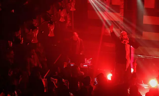 Hani Al Sawah, a Syrian rap artist known as Al Darwish, performs at a restaurant in old Damascus, Syria, Friday, Jan. 16, 2026. (AP Photo/Omar Sanadiki)