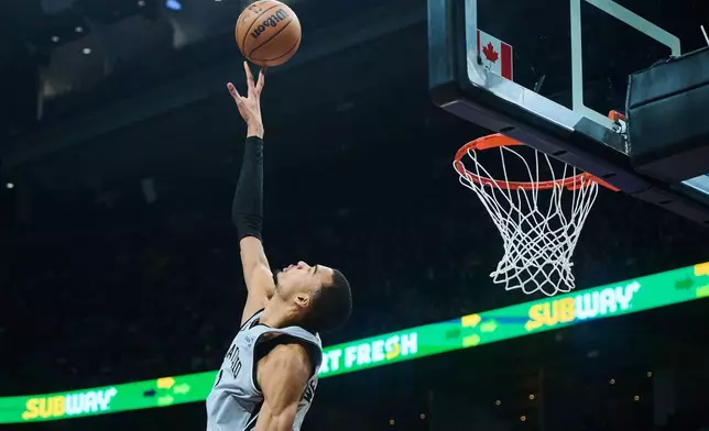 San Antonio Spurs' Victor Wembanyama (1) jumps to block a shot during the first half of an NBA basketball game, against the Toronto Raptors, in Toronto, Wednesday, Feb. 25, 2026. (Sammy Kogan/The Canadian Press via AP)