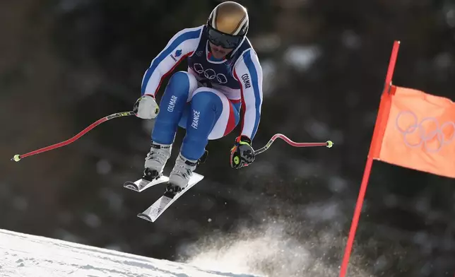 France's Nils Alphand speeds down the course during an alpine ski, men's downhill official training, at the 2026 Winter Olympics, in Bormio, Italy, Thursday, Feb. 5, 2026. (AP Photo/Gabriele Facciotti)