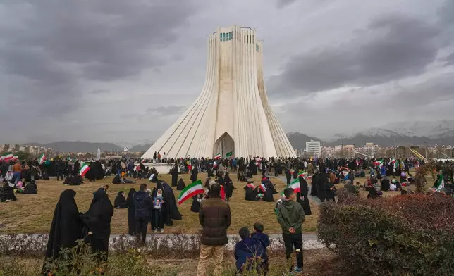 People attend an annual rally marking 1979 Islamic Revolution as they gather around the Azadi (Freedom) monument tower in Tehran, Iran, Wednesday, Feb. 11, 2026. (AP Photo/Vahid Salemi)