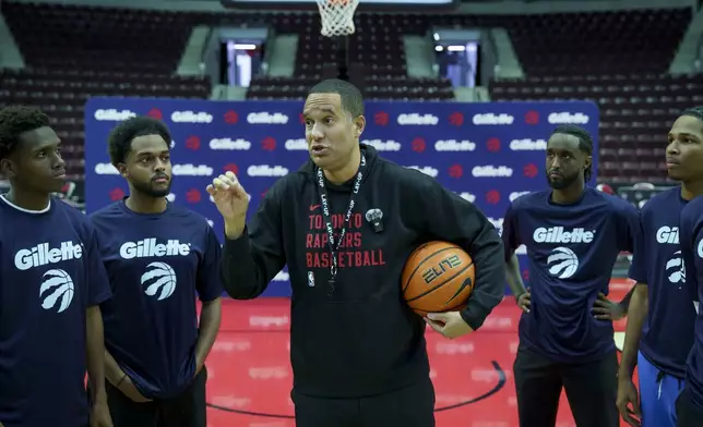 Toronto Raptors Assistant Coach, Jama Mahlalela, leads an on-court skills and leadership session with Lay-Up youth coaches during expanded coach training supported by Gillette in Toronto.